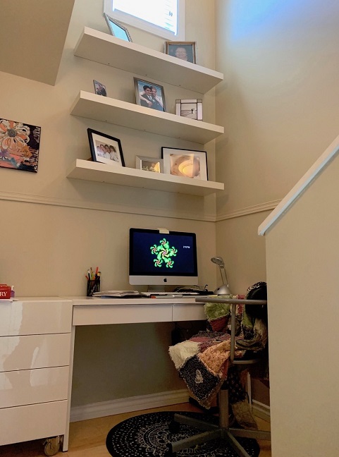 Author Tanya Lloyd Kyi's small desk, on a staircase landing.