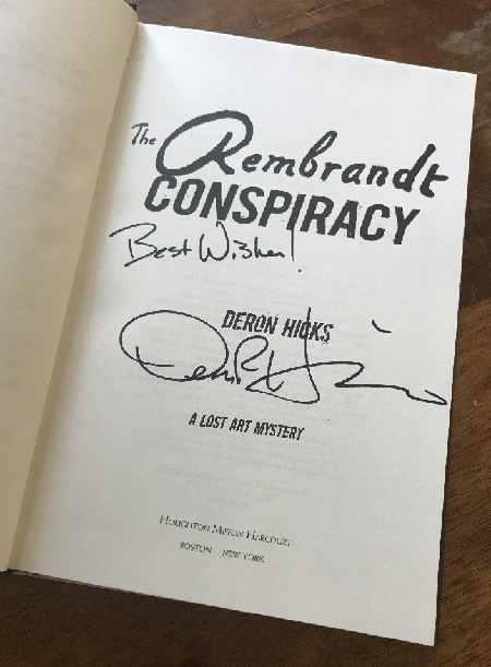 The title page of the novel The Rembrandt Conspiracy, signed by the author, Deron Hicks, with the message, "Best wishes!"