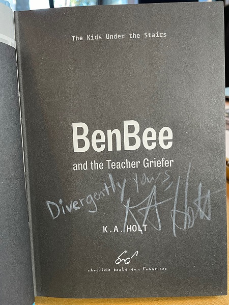 The title page of BenBee and the Teacher Griefer, signed by the author, K.A. Holt, with the message, "Divergently Yours!"