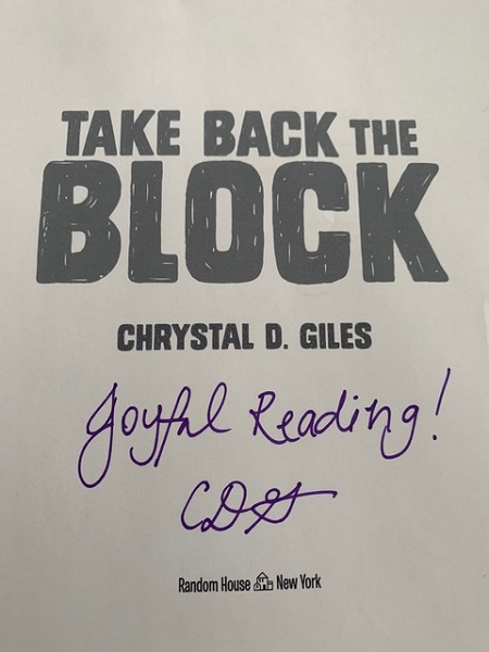 The title page of Take Back the Block, signed by the author Chyrstal Giles with the message, "Joyful Reading!"