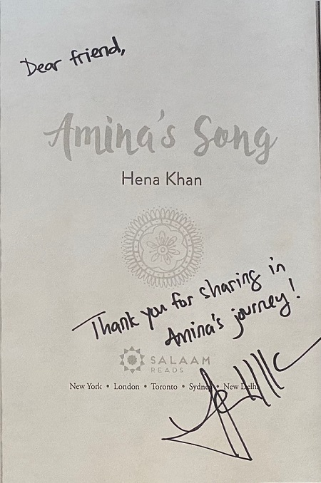 The title page of Amina's Song, signed by the author, Hena Khan, with the message, "Thank you for sharing in Amina's journey!"