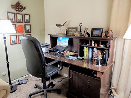 Author Lisa Fipps' writing desk, surrounded by meaningful objects.