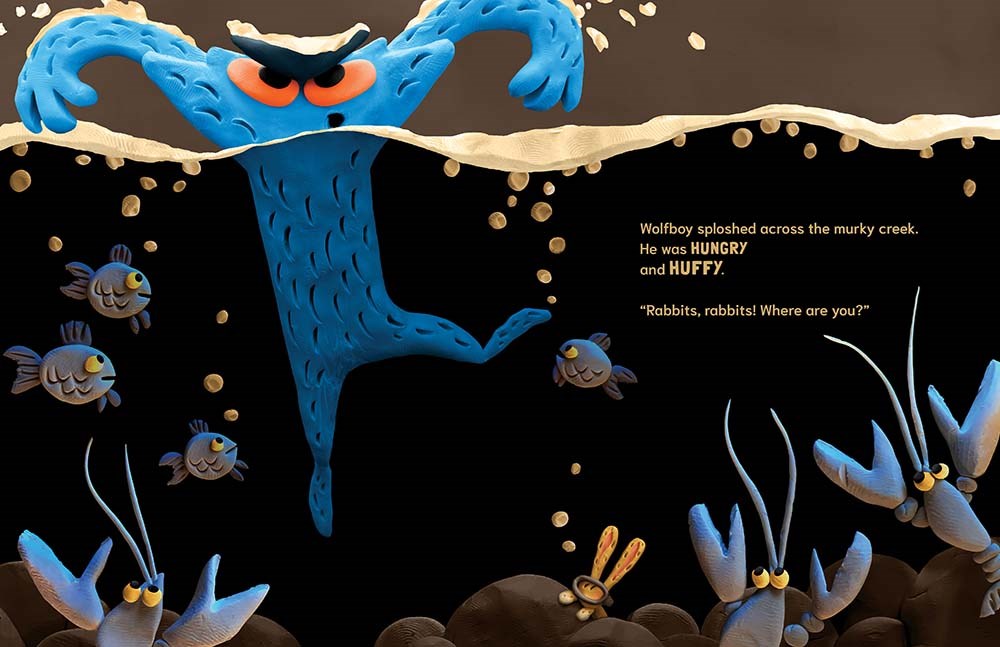 An interior image from Wolfboy, written and illustrated by Andy Harkness, showing Wolfboy, a blue creature, swimming through water searching for rabbits.