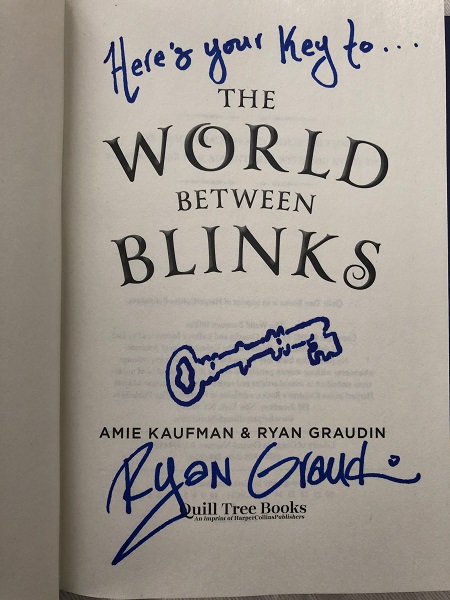 The title page of The World Between Blinks, signed by the co-author,Ryan Graudin, with the message, "Here's your key to..." The author also drew a picture of a key.