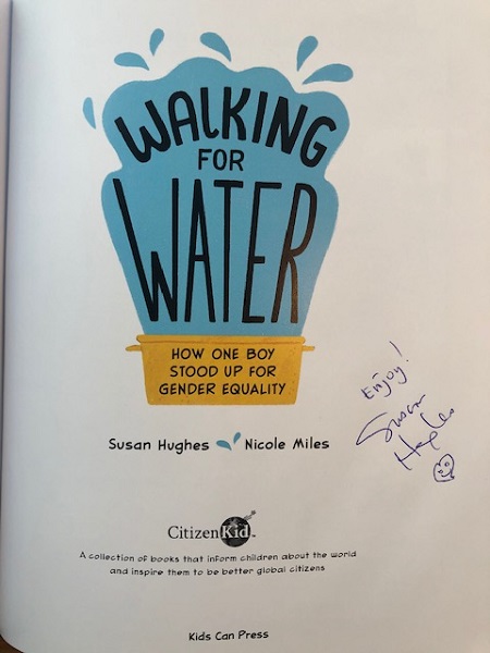 The title page of Walking for Water signed by the author, Susan Hughes, with the message, "Enjoy!"