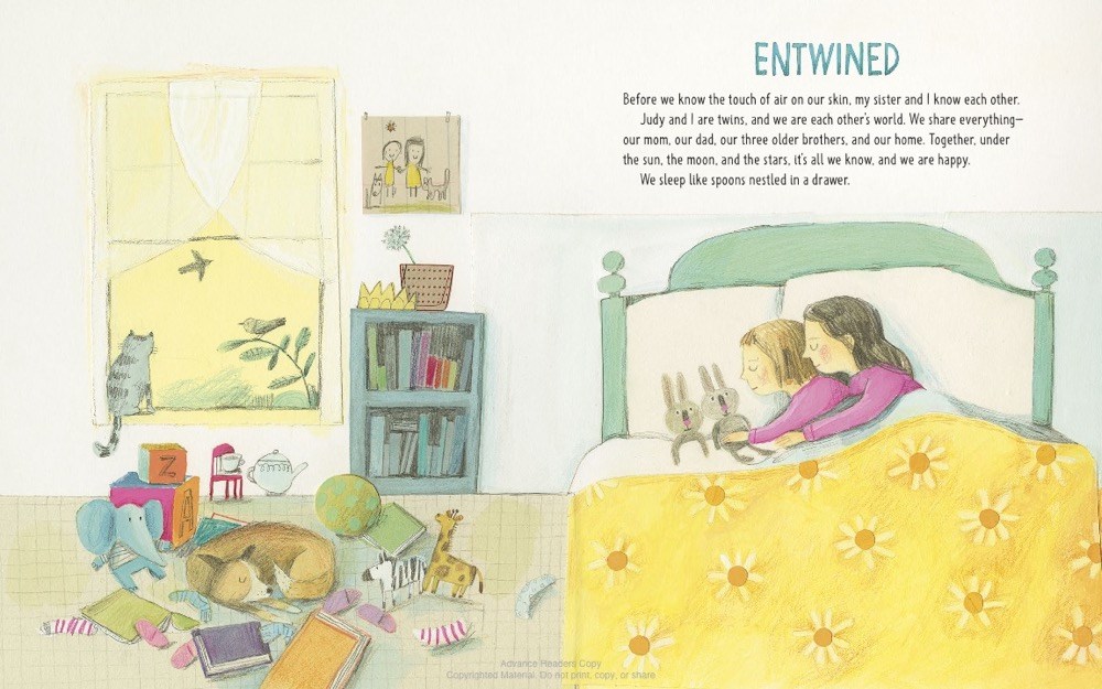 An interior image from Unbound: The Life and Art of Judith Scott showing Judith and Joyce Scott as children, snuggled and sleeping in a sunny bedroom.