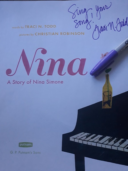 The title page of Nina: A Story of Nina Simone, signed by the author, Traci N. Todd, with the message, "Sing Your Song!"