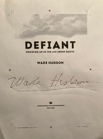 The title page of Defiant, signed by the author, Wade Hudson.