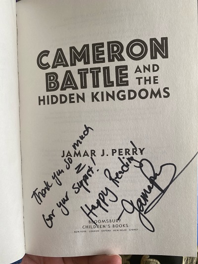The title page of Cameron Battle and the Hidden Kingdoms, signed by the author, Jamar J. Perry, with the message, "Thank you so much for your support! Happy reading!"