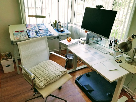 Author David Barclay Moore's study, with two white desks overlooking windows.