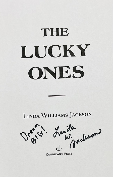 The title page of The Lucky Ones, signed by the author, Linda Williams Jackson, with the message, "Dream Big!"