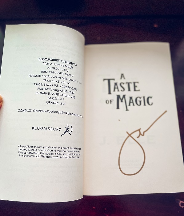 The title page of A Taste of Magic signed by the author, J. Elle.
