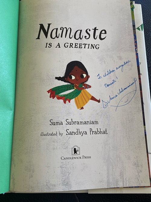 The title page of Namaste Is a Greeting signed by the author, Suma Subramaniam, with the greeting, "To children everywhere, namaste!"