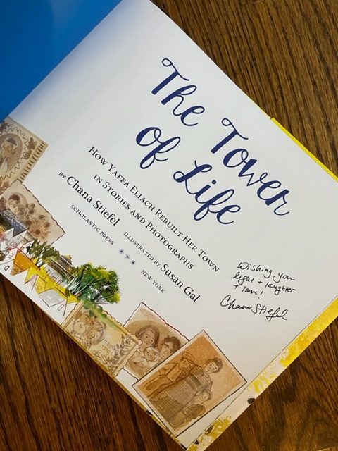 The title page of The Tower of Life, signed by the author, Chana Stiefel, with the message, "Wishing you light and laughter and love!"