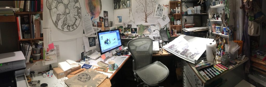 Author/illustrator Margaret Peot's studio, filled with shelves of painting supplies, works in progress, a drafting table, and a computer.