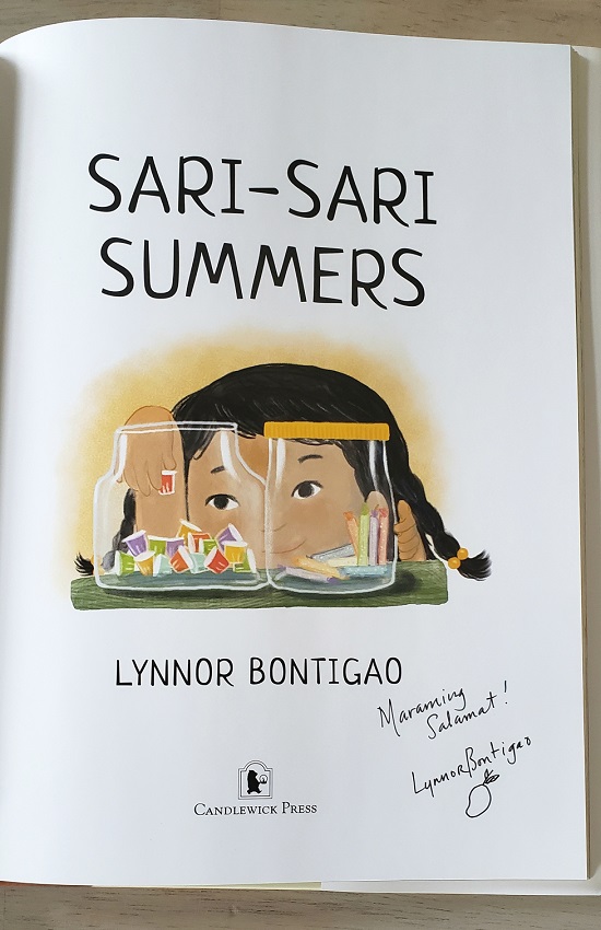 The title page of Sari-Sari Summers signed by the author-illustrator, Lynnor Bontigao, with the message, "Maraming Salamat!" It means, "Thank you very much," in Tagalog.