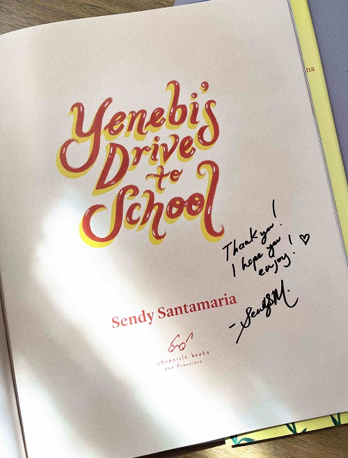 The title page of Yenebi's Drive to School, signed by the author-illustrator, Sendy Santamaria, with the message, "Thank you! I hope you enjoy!"