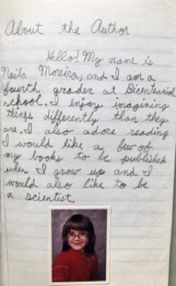 A page handwritten by Naila Moreira when she was in fourth grade. It reads, "Hello! My name is Naila Moreira, and I am a fourth grader. I enjoy imagining things differently than they are. I also adore reading. I would like a few of my books to be published when I grow up and I would also like to be a scientist." Below the handwriting is a school picture of the author in fourth grade.