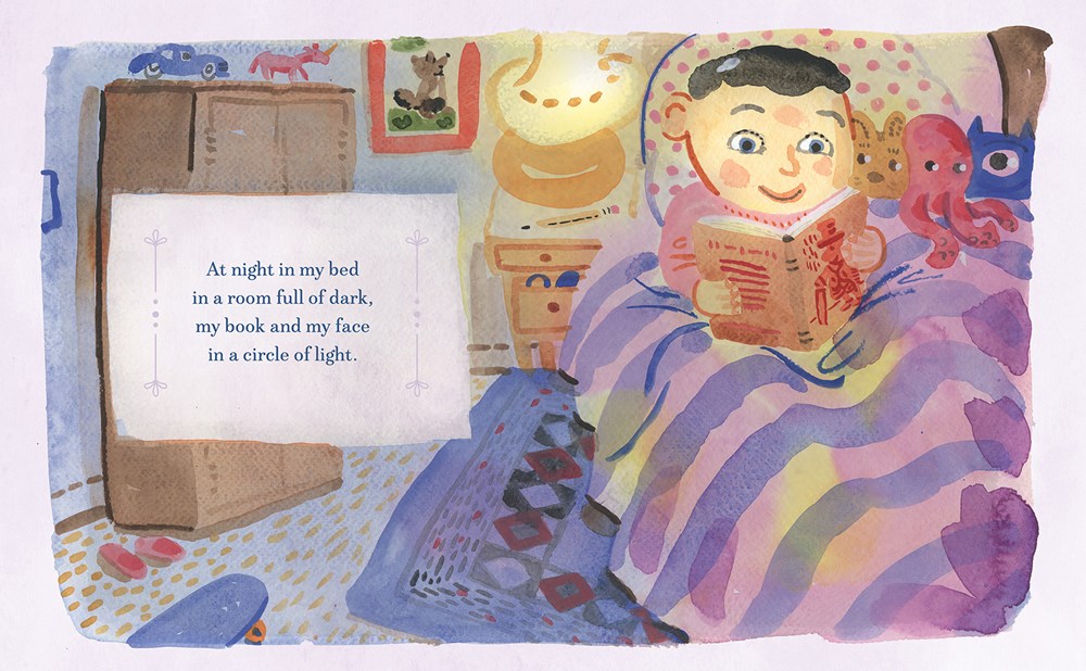 An interior spread from My Book and Me. The art shows a brown-haired, pale boy reading in bed, surrounded by stuffed animals, a cozy lamp next to him. The text reads: "At night in my bed in a room full of dark, my book and my face in a circle of light."