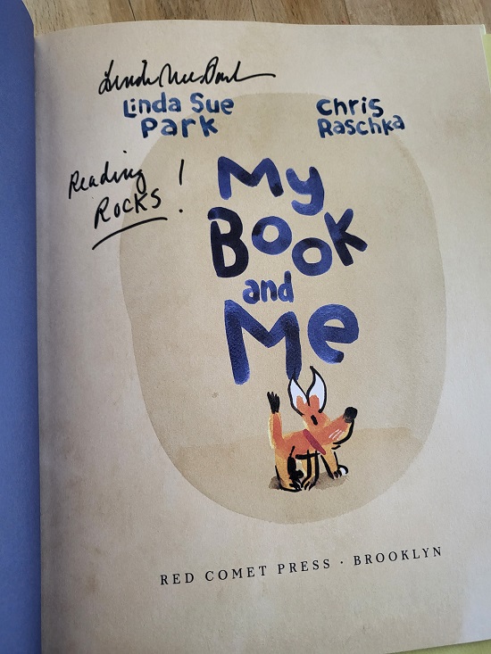 The title page of My Book and Me signed by Linda Sue Park with the message, "Reading Rocks!"