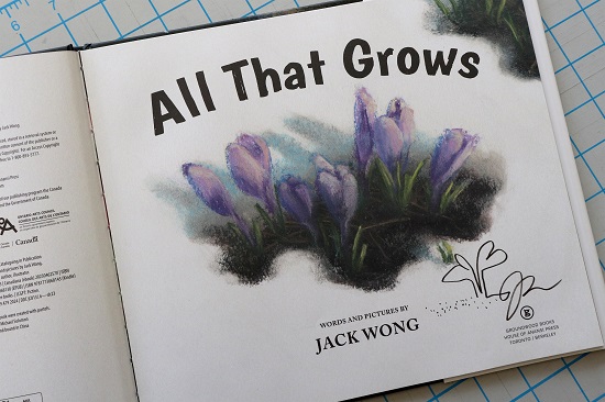 The title page of All That Grows, signed by the author, Jack Wong, with a small drawing of a plant.