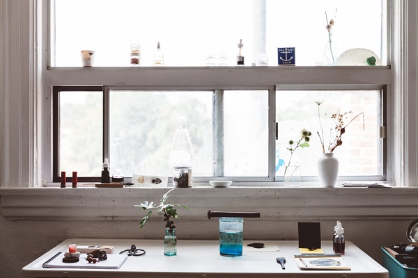 Jason Logan's ink-making workbench underneath a window.