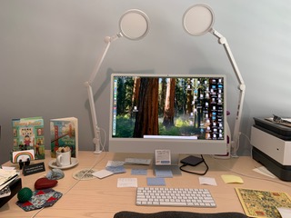 Margaret Finnegan's desk showing her computer and covers of her recent novels.